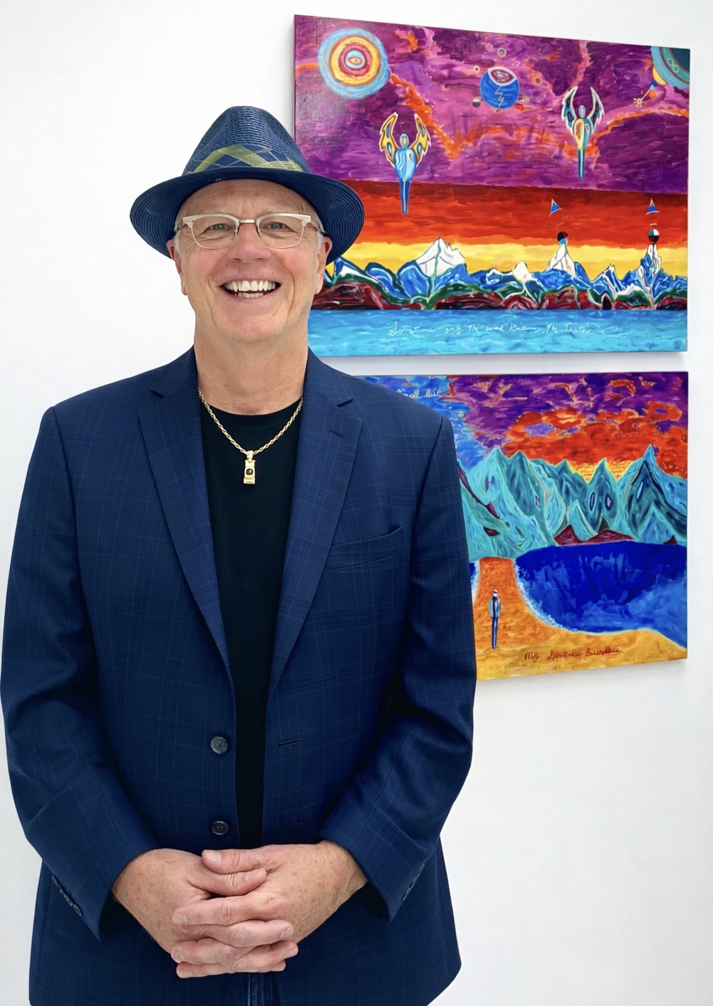 Michael Robinson with his paintings